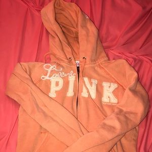 a pink victorious secret jacket.